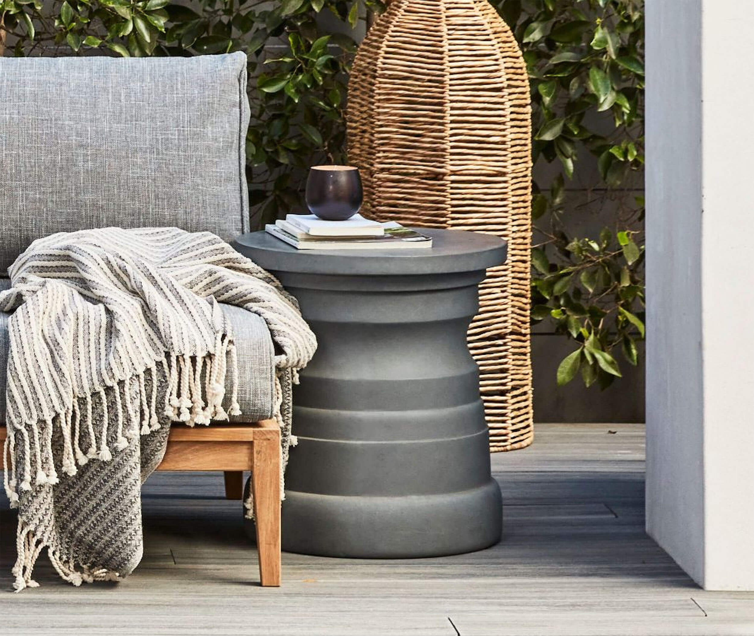 Outdoor side table next to a lounge chair
