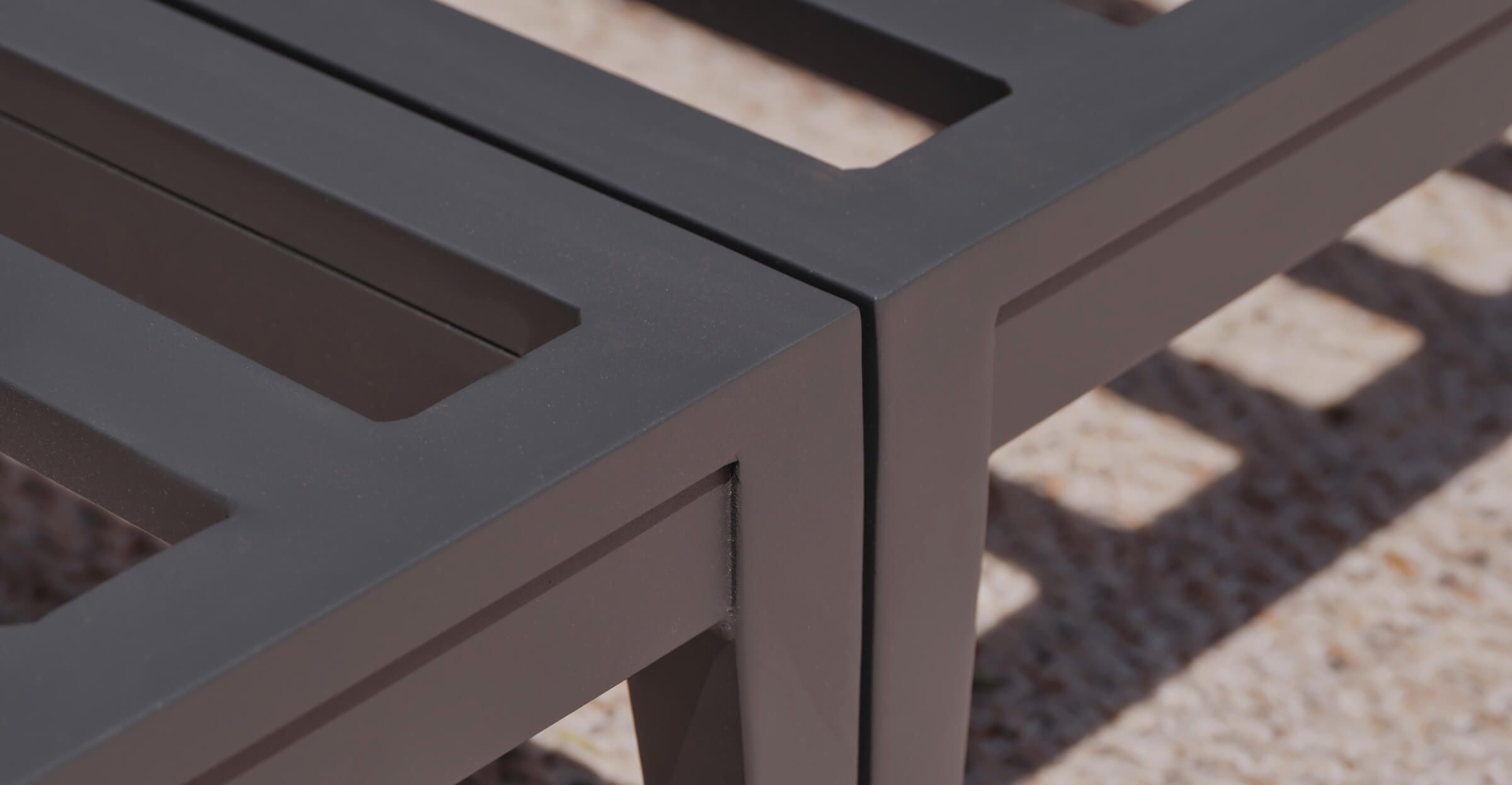 Close-up of an outdoor aluminum furniture frame corner with clean lines and a smooth matte finish
