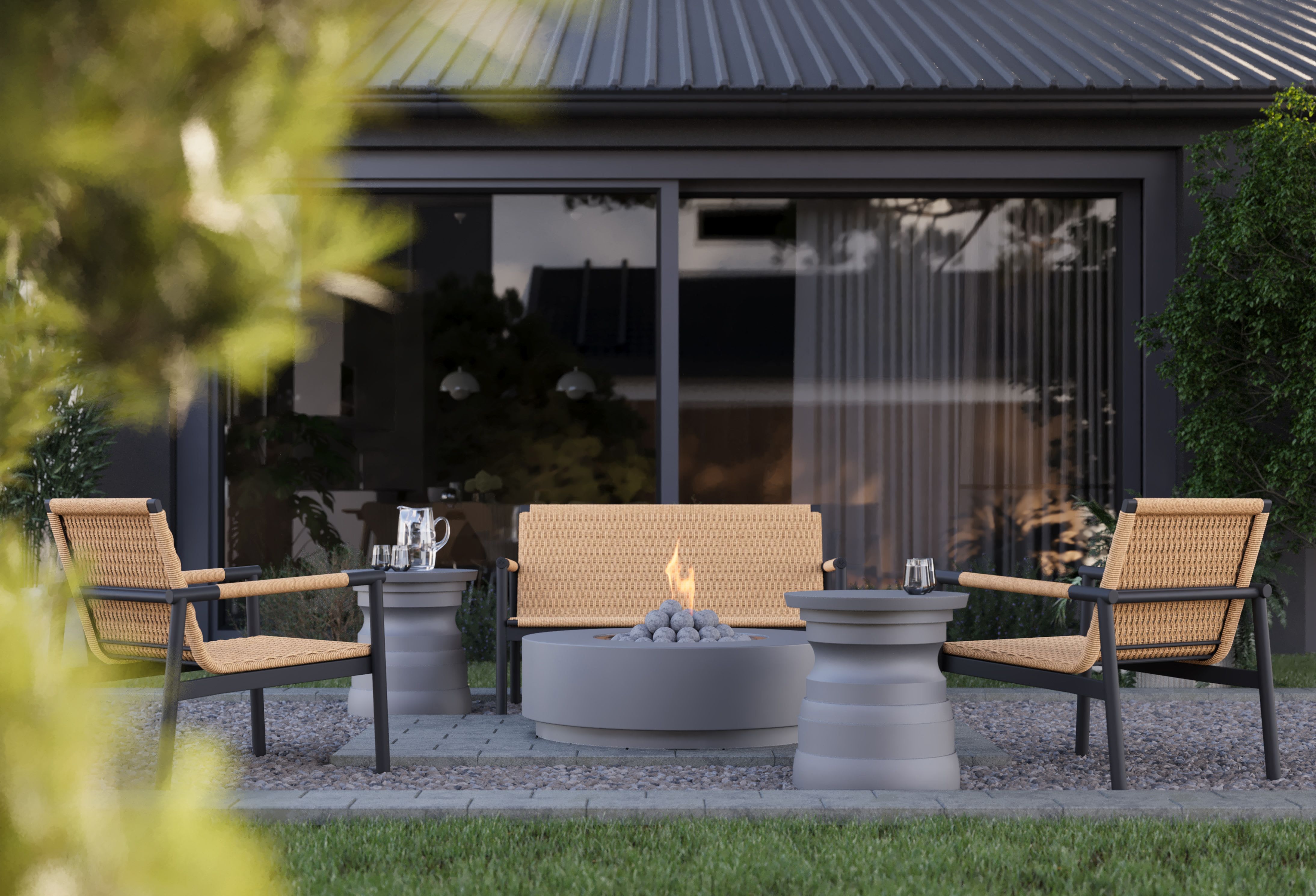 Outdoor side tables paired with lounge chairs and a fire pit, designed for durable outdoor living spaces