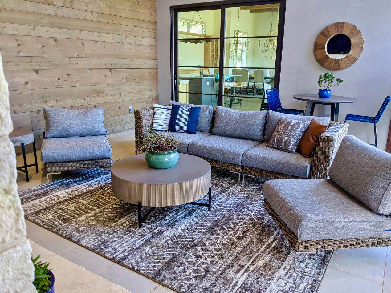 outdoor sectional sofa set with lounge chairs and round coffee table
