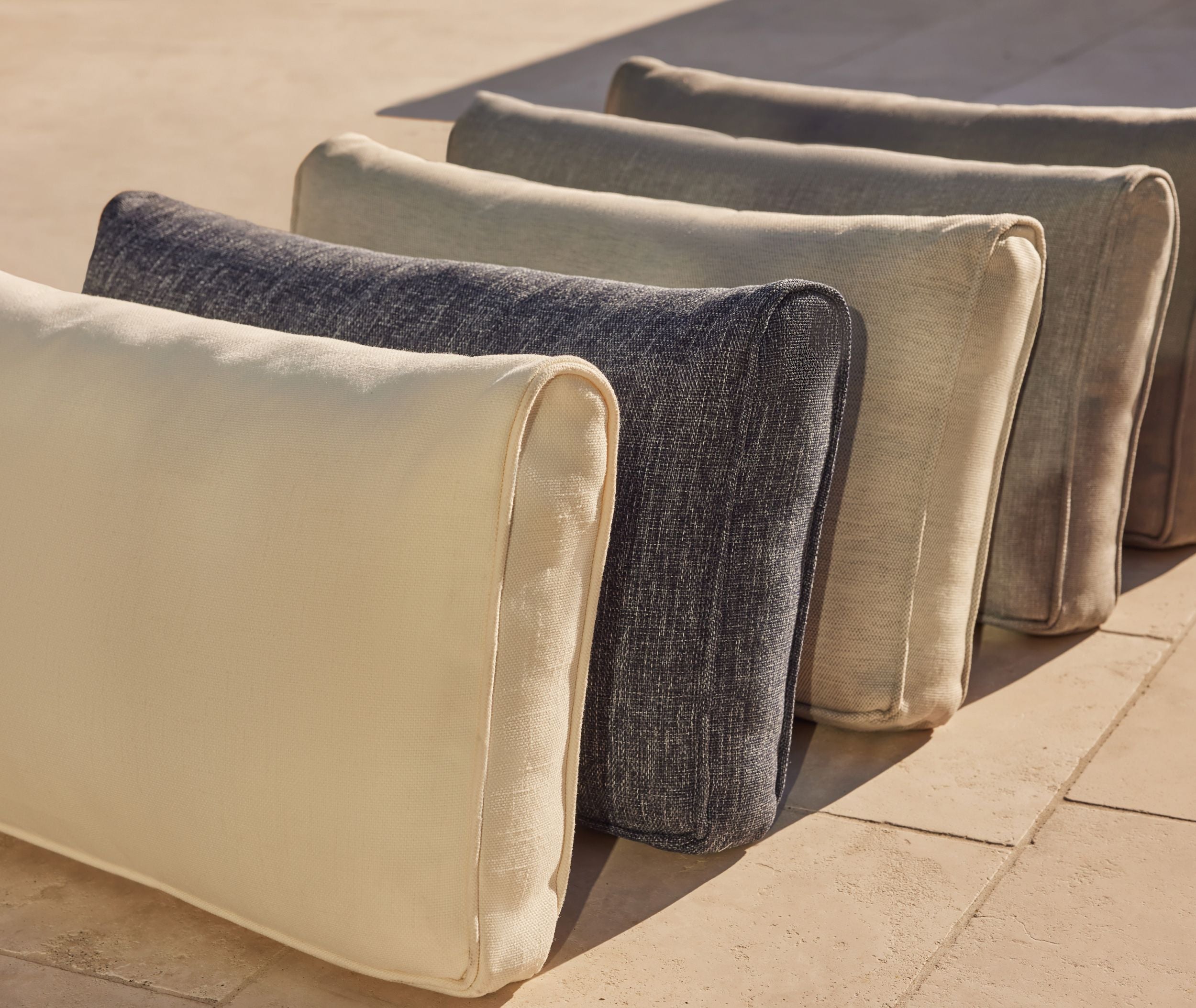 Outdoor furniture fabric swatches displayed in neutral color options