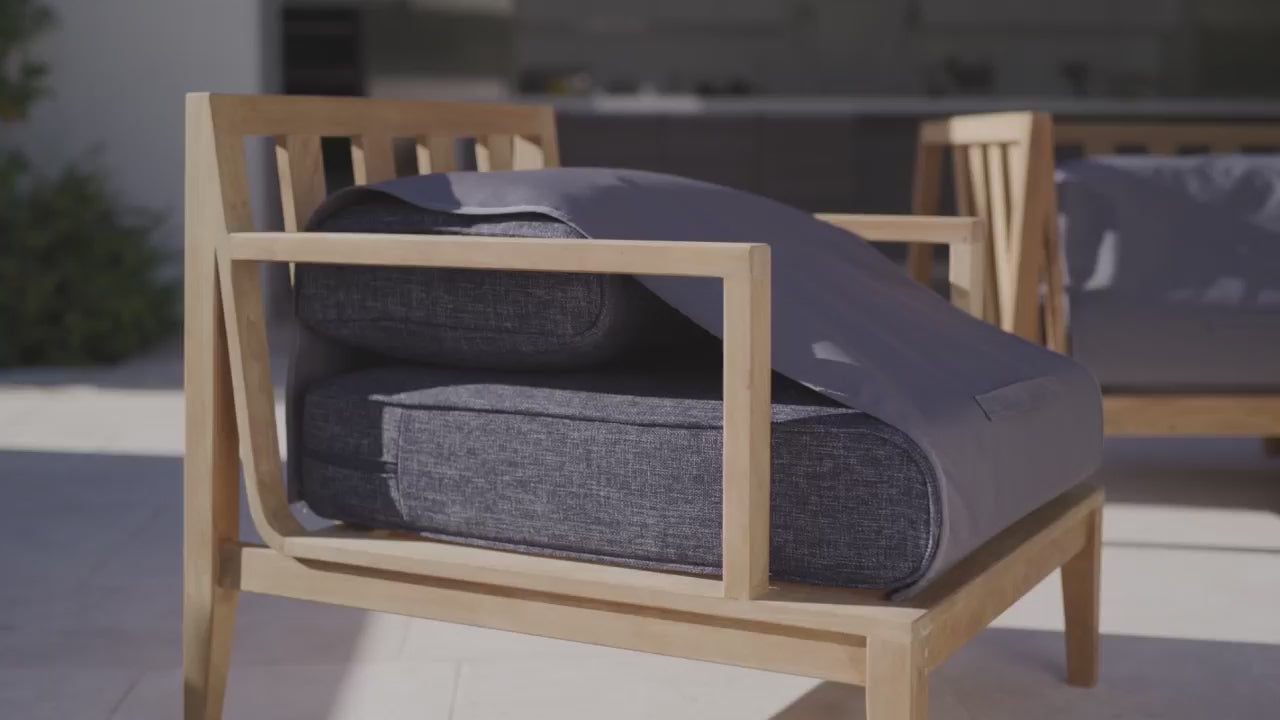 Video showing the patented OuterShell design repelling water while quickly wrapping outdoor sofa cushions for easy lift-and-carry storage.