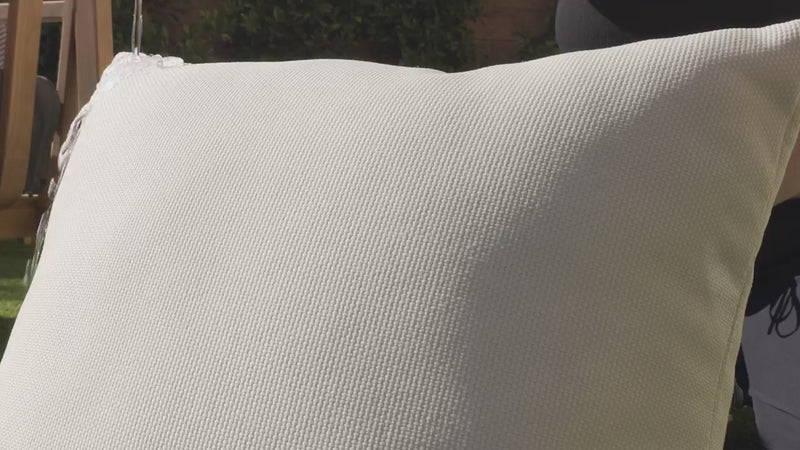 OuterWeave outdoor fabric demonstrating water-resistant performance as water beads on the surface without soaking in