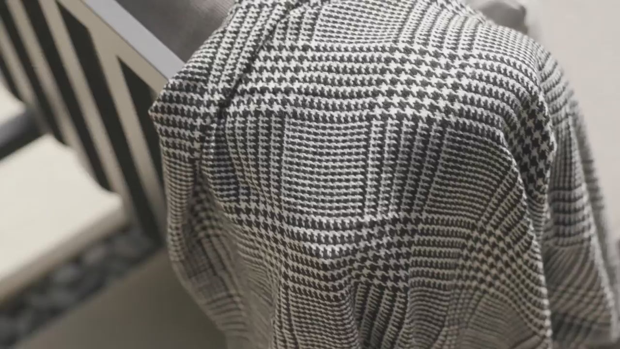 Outer Bug Shield Blanket draped over outdoor seating, showing the woven fabric design and providing insect protection for outdoor lounging.
