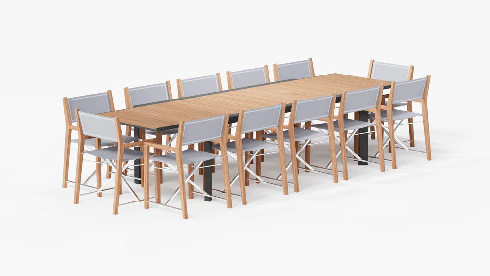 Outer teak and aluminum expandable outdoor dining table with 12 teak director’s chairs, studio product view