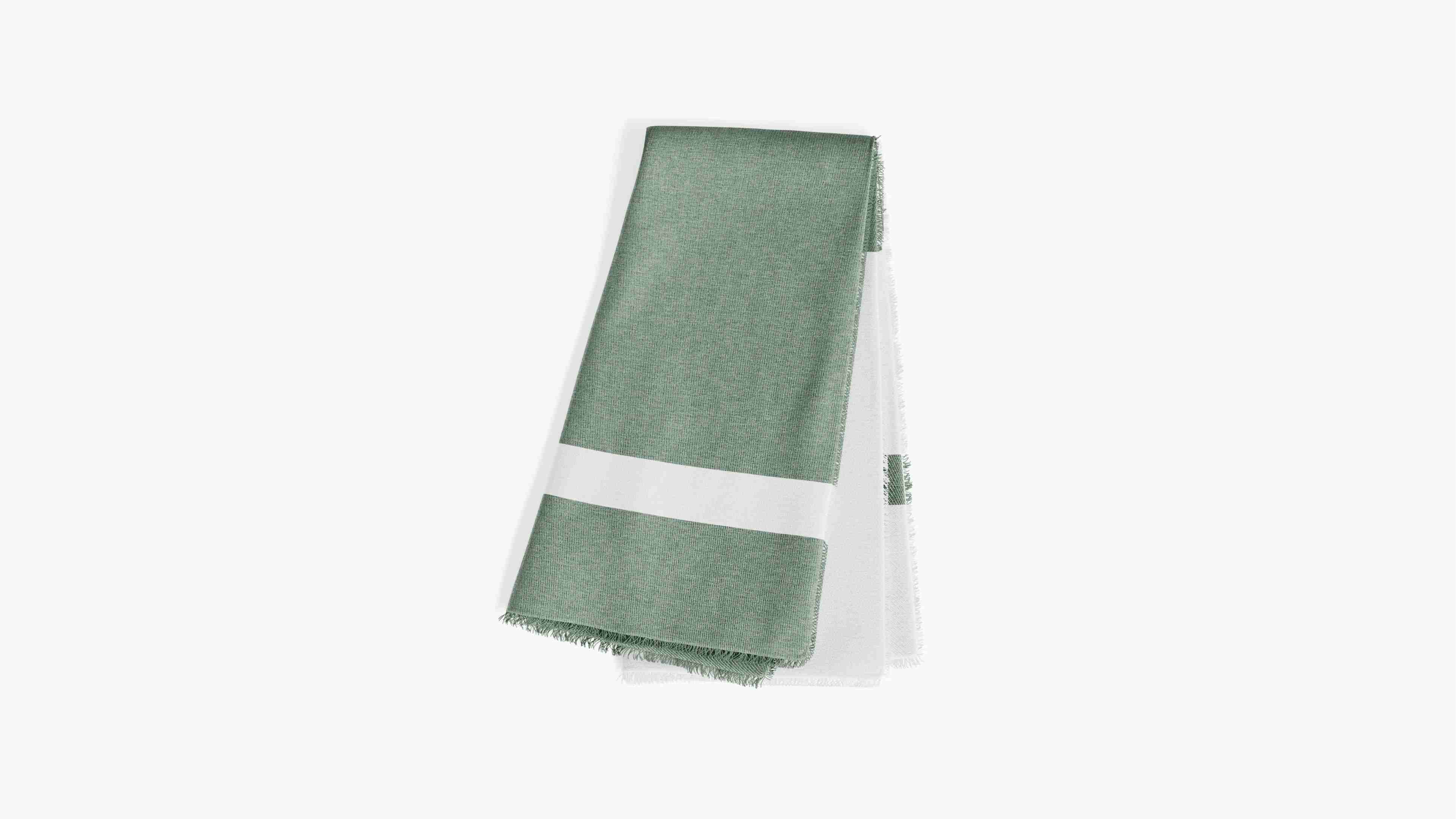 Folded outdoor bug blanket in forest green color on a white background
