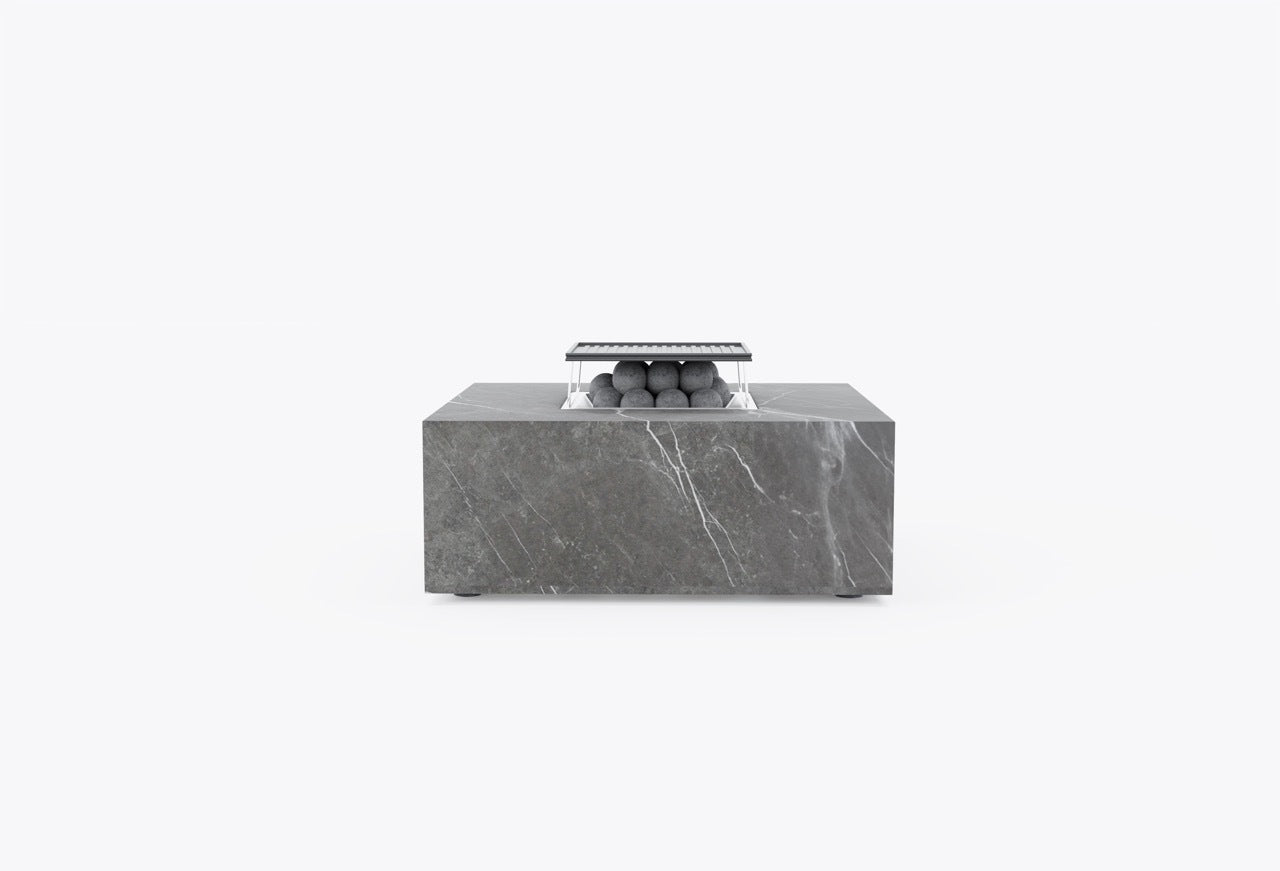 Large square stone outdoor fire pit with integrated cooking set and lava rocks
