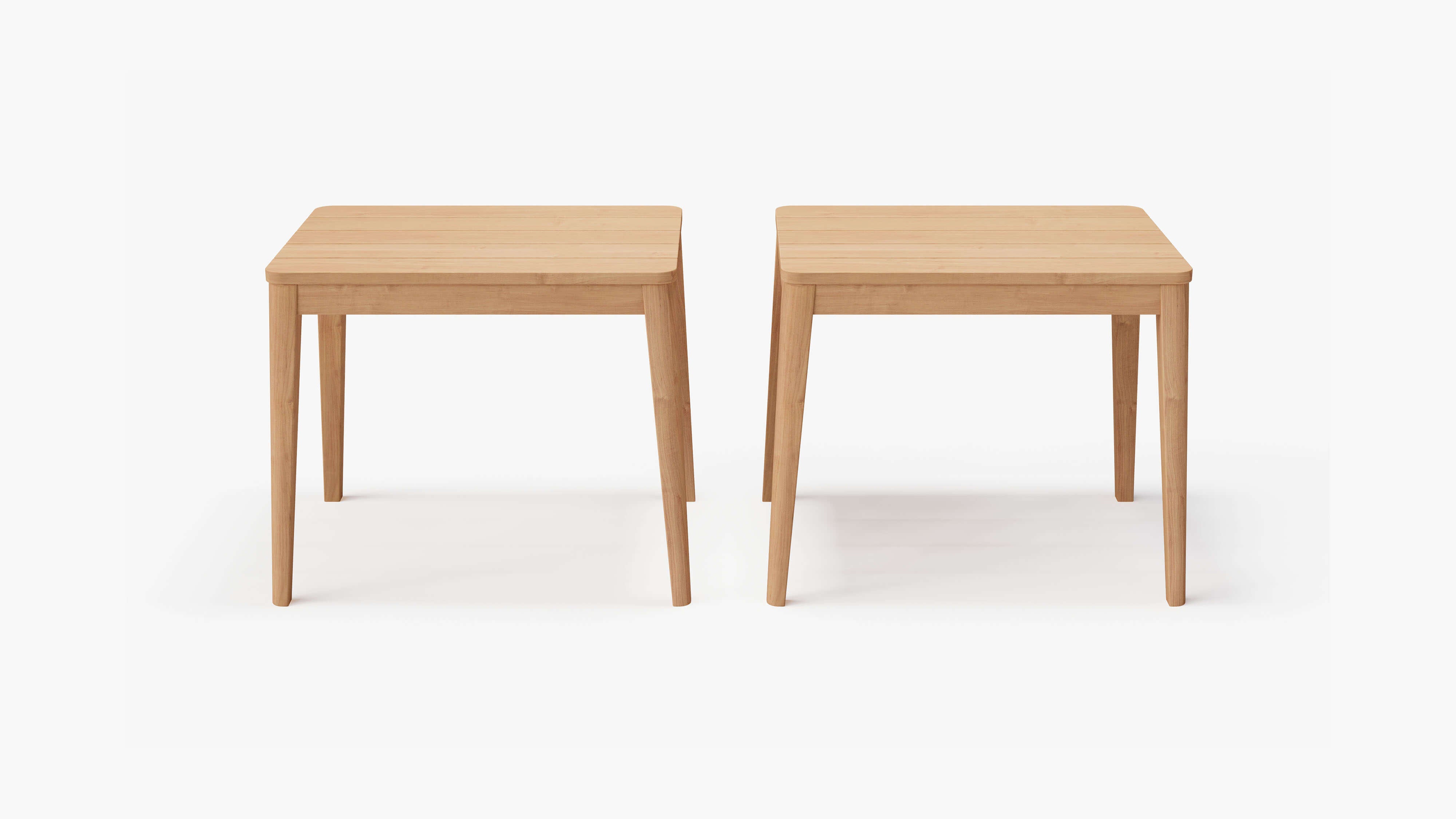 A set of two teak side tables with a natural wood finish, featuring round tops and three slightly tapered legs each, designed for versatile use beside sofas or chairs.-teak side table-outer #shape_rectangular