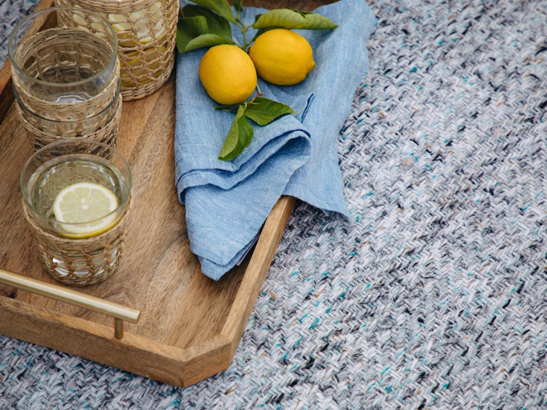 Closeup photograph of the Eco-Friendly Outdoor Rug in Pebble Gray.