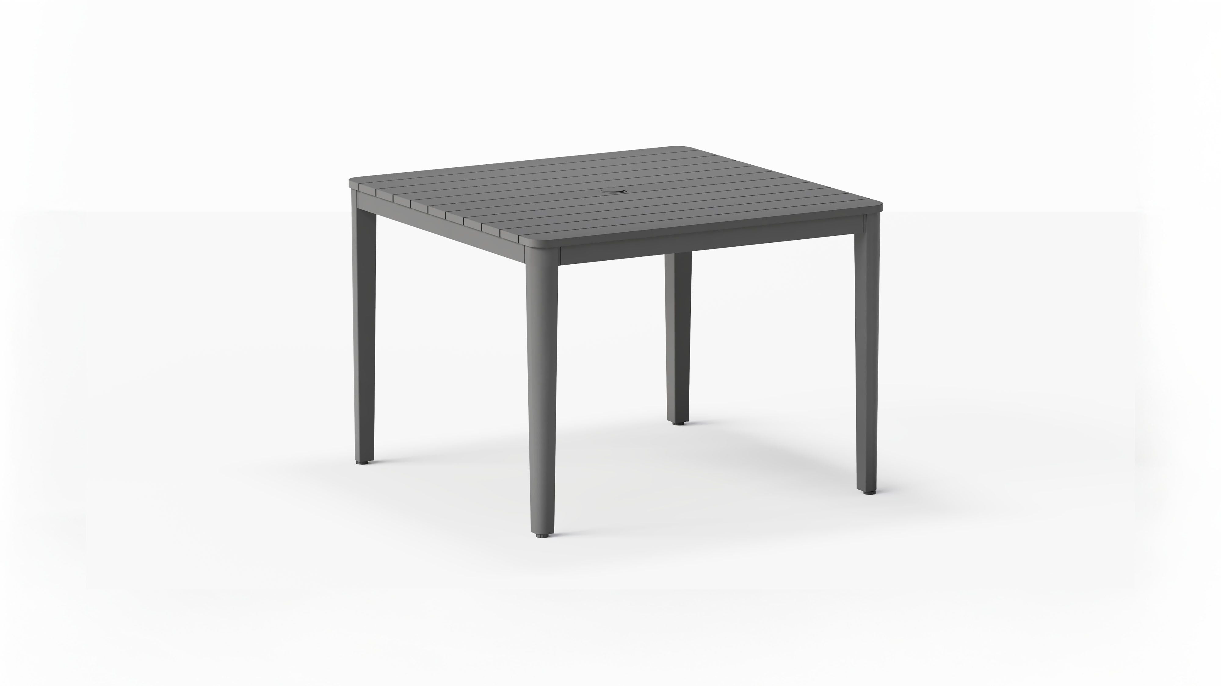 outer-dining table-Charcoal aluminum square outdoor dining table with slatted top and umbrella hole shown in a clean studio setting