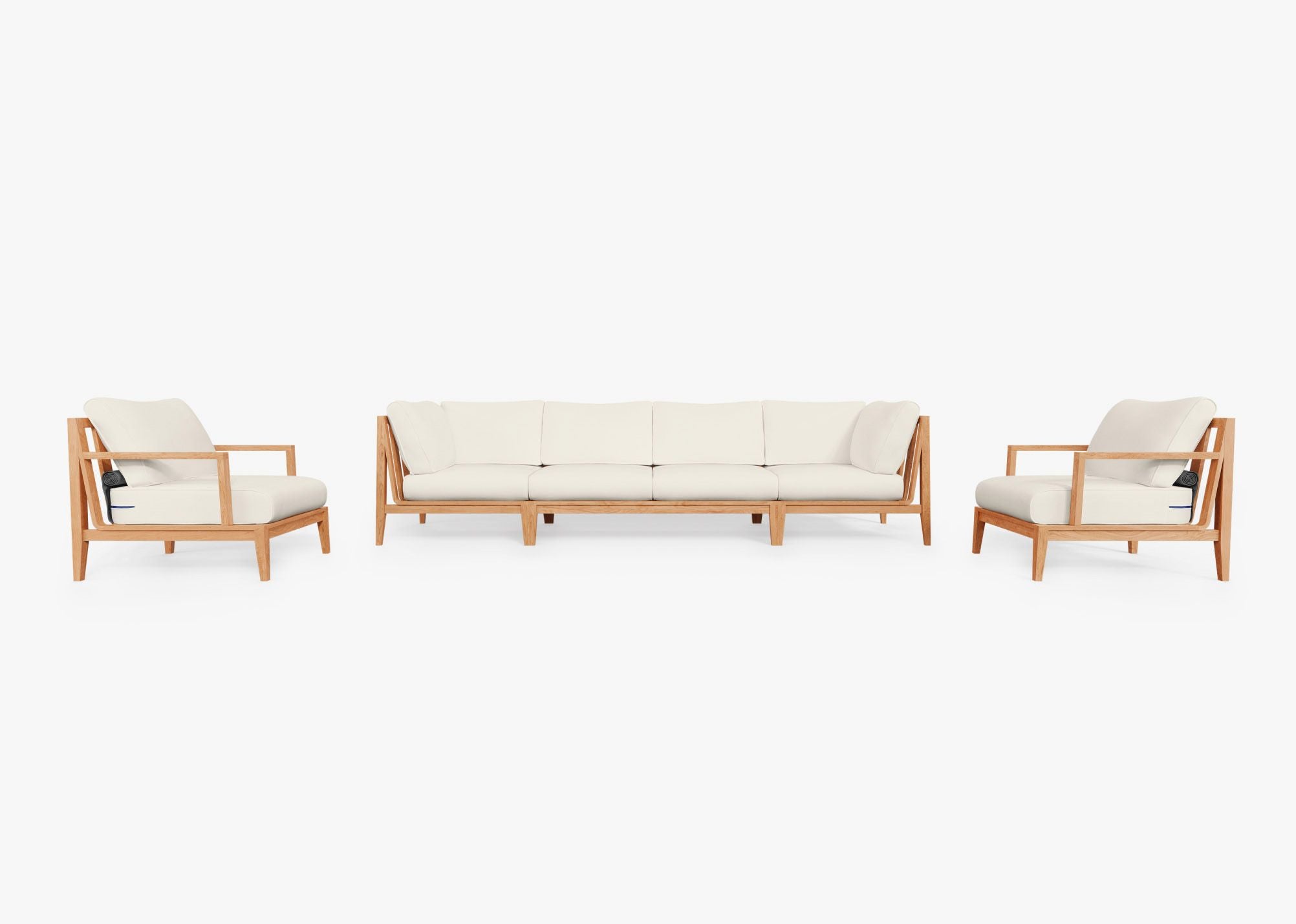 Teak outdoor sofa with matching armchairs, featuring cream cushions arranged in a six-seat configuration on a patio.-teak outdoor sofa-outer #color_palisades cream