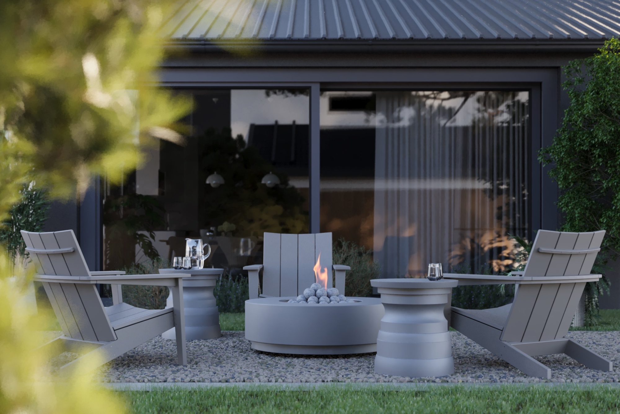 Adirondack outdoor chairs paired with a round concrete fire pit table on a modern patio outside a contemporary home